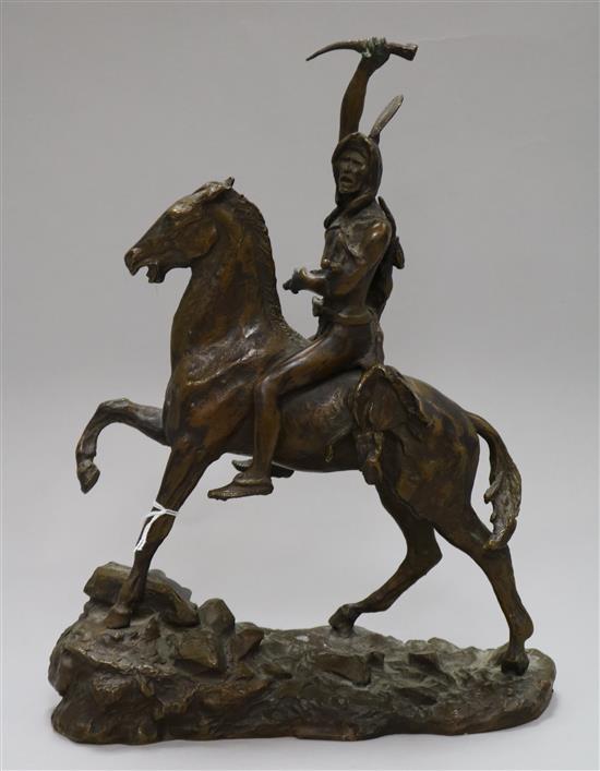 After Remington. A bronze group of a Native American warrior on horse back, signed in the bronze, height 29cm